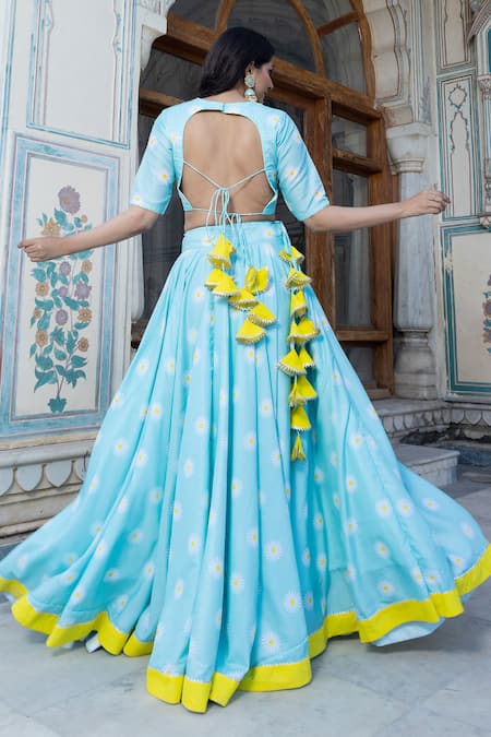 Shop Pomcha Jaipur Blue Muslin, Chiffon Tassels V-neck Daylilly Floral Print Blouse Lehenga Set at Aza Fashions Shop_Pomcha Jaipur_Blue Muslin, Chiffon Tassels V-neck Daylilly Floral Print Blouse Lehenga Set _at_Aza_Fashions