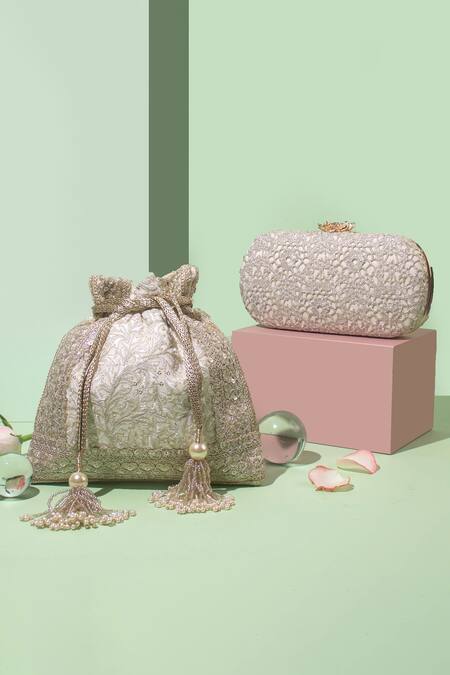 Shop Amyra Off White Embroidery, Tassels Inaya Thread And Zari Potli Bag at Aza Fashions Shop_Amyra_Off White Embroidery, Tassels Inaya Thread And Zari Potli Bag_at_Aza_Fashions