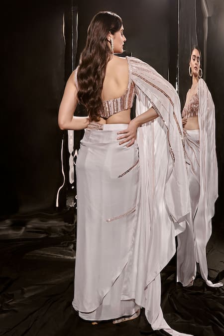 Shop Masumi Mewawalla Pink Crepe Sequins, Cut Work, Crystals Embellished Skirt With Corset Blouse at Aza Fashions Shop_Masumi Mewawalla_Pink Crepe Sequins, Cut Work, Crystals Embellished Skirt With Corset Blouse _at_Aza_Fashions