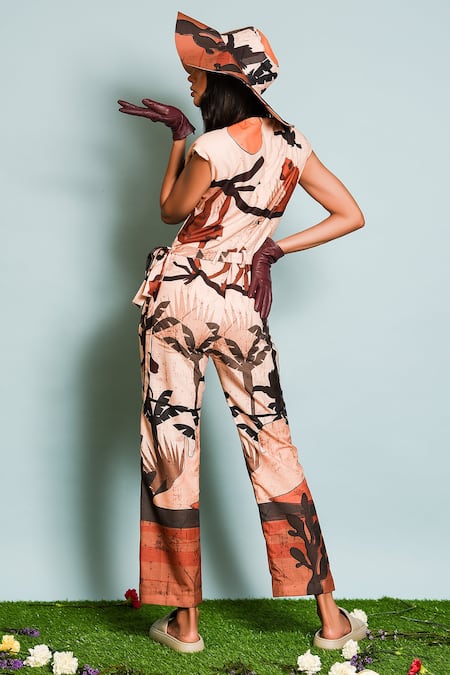 Shop The Dramebaaz CO Brown Cotton, Silk Round Neck Safari Print Jumpsuit at Aza Fashions Shop_The Dramebaaz CO_Brown Cotton, Silk Round Neck Safari Print Jumpsuit _at_Aza_Fashions