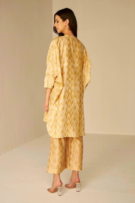 Shop Betrue Beige Chanderi Silk Chains Split V-neck Placket Embroidered Top And Pant Set at Aza Fashions Shop_Betrue_Beige Chanderi Silk Chains Split V-neck Placket Embroidered Top And Pant Set _at_Aza_Fashions