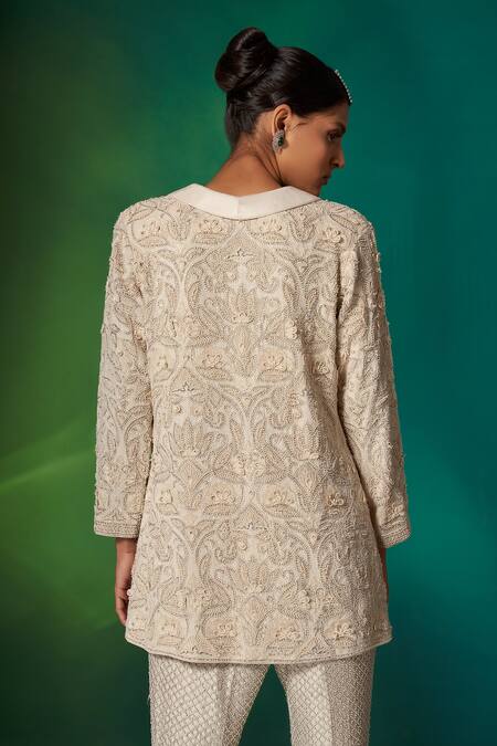 Shop Stotram Ivory Dupioni Silk Embroidery Sequins Jacket Lapel Floral Hand Pant Set at Aza Fashions Shop_Stotram_Ivory Dupioni Silk Embroidery Sequins Jacket Lapel Floral Hand Pant Set_at_Aza_Fashions