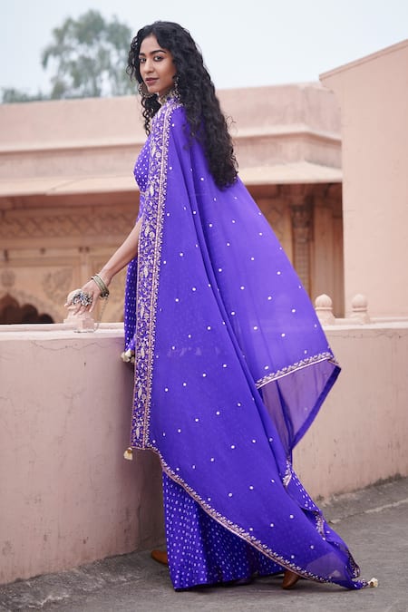 Shop Pink City By Sarika Purple Silk, Chiffon Sequins, Tassels V-neck Cross Yoke Anarkali Gharara Set at Aza Fashions Shop_Pink City By Sarika_Purple Silk, Chiffon Sequins, Tassels V-neck Cross Yoke Anarkali Gharara Set_at_Aza_Fashions