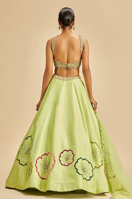 Shop Nitika Gujral Green Lehenga And Blouse Raw Silk & Dupatta Net Embroidery Floral Applique Set at Aza Fashions Shop_Nitika Gujral_Green Lehenga And Blouse Raw Silk & Dupatta Net Embroidery Floral Applique Set _at_Aza_Fashions