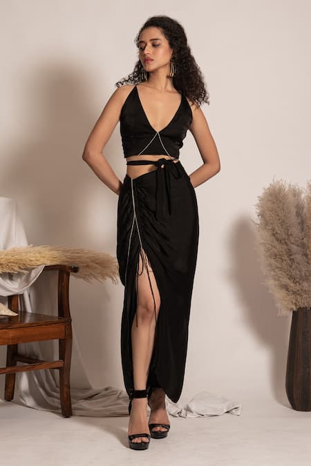 Shop Vanshika Agarwal Label Black Satin, Taffeta Rhinestones Plunge Neck Tie-up Bralette And Ruched Skirt Set at Aza Fashions Shop_Vanshika Agarwal Label_Black Satin, Taffeta Rhinestones Plunge Neck Tie-up Bralette And Ruched Skirt Set _at_Aza_Fashions
