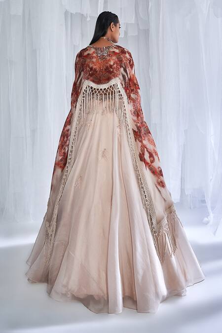 Shop Dolly J Ivory Organza Feathers, Embroidery Plunge Pixie Lehenga Set With Printed Cape at Aza Fashions Shop_Dolly J_Ivory Organza Feathers, Embroidery Plunge Pixie Lehenga Set With Printed Cape _at_Aza_Fashions