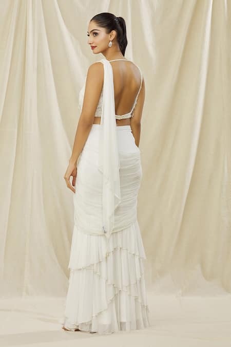 Shop Arpan Vohra Ivory Georgette Pearls Square Neck Solid Pre Draped Saree With Tasselled Blouse at Aza Fashions Shop_Arpan Vohra_Ivory Georgette Pearls Square Neck Solid Pre Draped Saree With Tasselled Blouse _at_Aza_Fashions