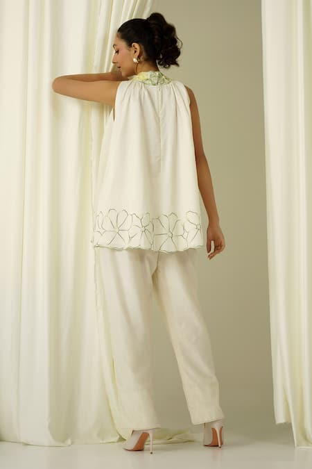 Shop Sakshi Khetterpal Ivory Chanderi Pearls, Beads, Embroidery Halter Neck Top And Pant Set at Aza Fashions Shop_Sakshi Khetterpal_Ivory Chanderi Pearls, Beads, Embroidery Halter Neck Top And Pant Set _at_Aza_Fashions