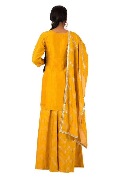 Shop_Meghna Shah_Yellow Dola Silk Hand Printed Stones V Neck Kurta With Palazzo Set _at_Aza_Fashions