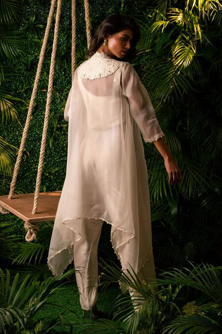 Shop Pallavi Poddar Ivory Organza, Satin, Cotton, Lycra Pearls Round Neck Peacock Cape And Pant Set at Aza Fashions Shop_Pallavi Poddar_Ivory Organza, Satin, Cotton, Lycra Pearls Round Neck Peacock Cape And Pant Set _at_Aza_Fashions