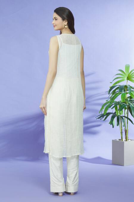 Shop Shruti Sancheti Ivory Cotton Embroidery Cut-work V Neck Yoke Tunic at Aza Fashions Shop_Shruti Sancheti_Ivory Cotton Embroidery Cut-work V Neck Yoke Tunic_at_Aza_Fashions