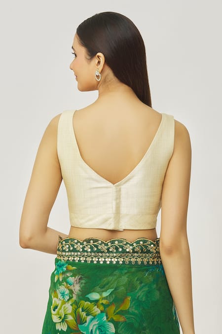 Shop_Naintara Bajaj_Gold Muslin Plunge Neck Metallic Solid Blouse _at_Aza_Fashions