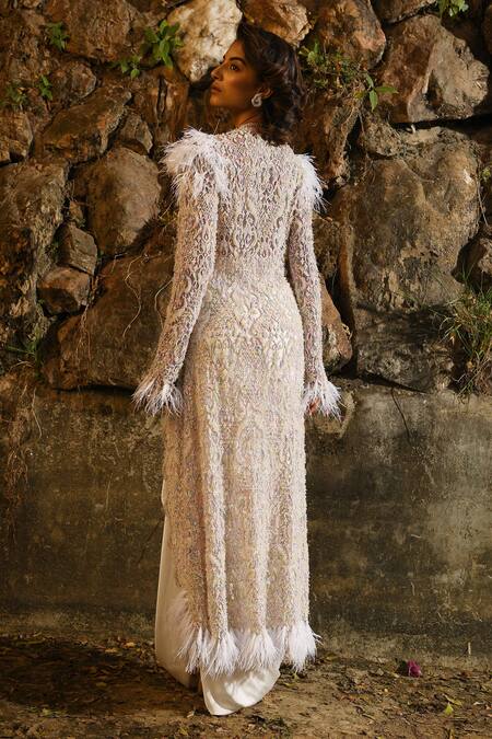 Shop House of Exotique Ivory Silk Embroidery V-neck Embellished Jacket And Draped Skirt Set at Aza Fashions Shop_House of Exotique_Ivory Silk Embroidery V-neck Embellished Jacket And Draped Skirt Set _at_Aza_Fashions