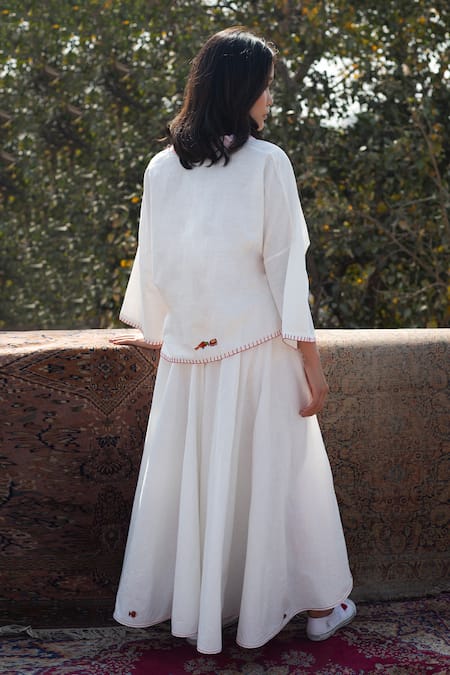 Shop Nikasha White Cotton Embroidered Wrap Skirt at Aza Fashions Shop_Nikasha_White Cotton Embroidered Wrap Skirt _at_Aza_Fashions