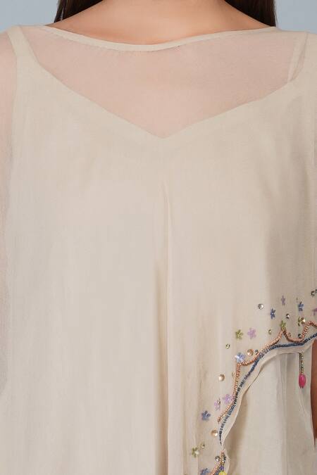 Devyani Mehrotra_Beige Viscose Double Georgette Embroidered Flower Work Border Cape And Pant Set_at_Aza_Fashions