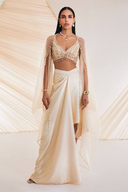 Divya Aggarwal Ivory Satin Crystals, Pearls, Sequins V-neck Leaf Embroidered Cape Skirt Set Online at Aza Fashions Divya Aggarwal_Ivory Satin Crystals, Pearls, Sequins V-neck Leaf Embroidered Cape Skirt Set _Online_at_Aza_Fashions