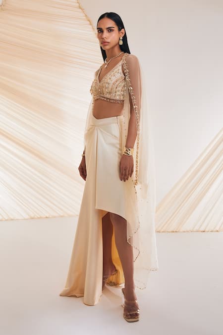 Buy Divya Aggarwal Ivory Satin Crystals, Pearls, Sequins V-neck Leaf Embroidered Cape Skirt Set Online at Aza Fashions Buy_Divya Aggarwal_Ivory Satin Crystals, Pearls, Sequins V-neck Leaf Embroidered Cape Skirt Set _Online_at_Aza_Fashions