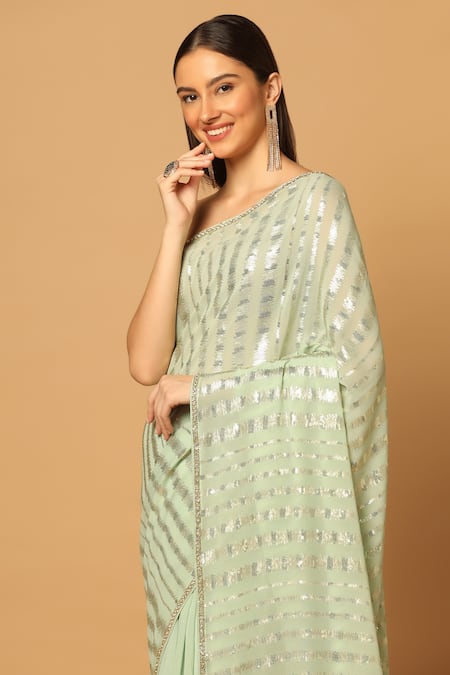 Two Sisters By Gyans Green Georgette Sequins Stripe Pattern Saree With Unstitched Blouse Fabric at Aza Fashions Two Sisters By Gyans_Green Georgette Sequins Stripe Pattern Saree With Unstitched Blouse Fabric _at_Aza_Fashions