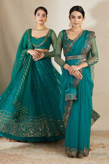 ASTHA NARANG Green Net, Crepe, Nylon Sequins, Embroidery, Cut Work Floral Lehenga Set at Aza Fashions ASTHA NARANG_Green Net, Crepe, Nylon Sequins, Embroidery, Cut Work Floral Lehenga Set _at_Aza_Fashions