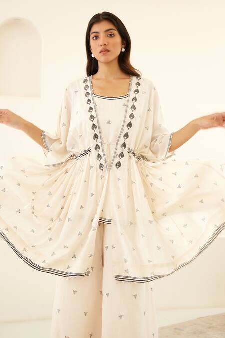 Cotton And Clay White Silk, Modal Embroidery, Beluga Hand Block Print Kurta Flared Trouser Set at Aza Fashions Cotton And Clay_White Silk, Modal Embroidery, Beluga Hand Block Print Kurta Flared Trouser Set _at_Aza_Fashions