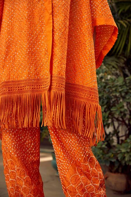 Buy Twenty Nine Orange Crepe Fringe V-neck Crushed Bandhani Hoodie Online at Aza Fashions Buy_Twenty Nine_Orange Crepe Fringe V-neck Crushed Bandhani Hoodie _Online_at_Aza_Fashions