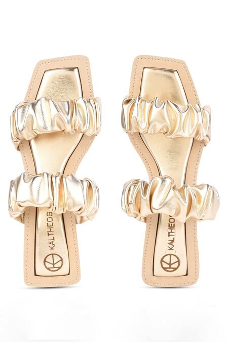 Kaltheos Gold Plain Maureen Metallic Ruffle Strap Block Heels Online at Aza Fashions Kaltheos_Gold Plain Maureen Metallic Ruffle Strap Block Heels_Online_at_Aza_Fashions