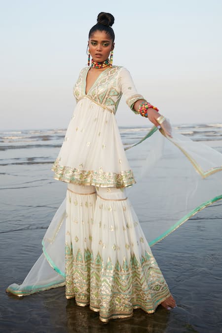 Shop_Gopi Vaid_White Georgette And Chiffon Ikat & Sequin V Neck Zohra Peplum Kurta Sharara Set_Online_at_Aza_Fashions