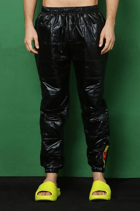 Buy_I Am Trouble By KC_Black Holographic Quilted Joggers_Online_at_Aza_Fashions