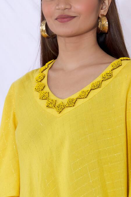 Urvashi Joneja_Yellow Cotton V Neckline Embellished Draped Dress_at_Aza_Fashions