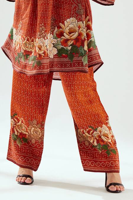 Rajdeep Ranawat_Orange Satin Permaz Floral And Geometric Print Pant_at_Aza_Fashions