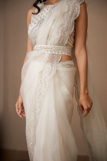 ASTHA NARANG_White Organza, Crepe Sequins, Cut Work, Zari, Scallop Border Saree With Blouse _at_Aza_Fashions