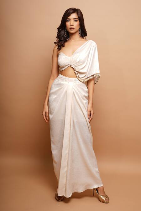 Buy Ahi Clothing Off White Lycra Tassels One Shoulder Twisted Top And Draped Skirt Set Buy_Ahi Clothing_Off White Lycra Tassels One Shoulder Twisted Top And Draped Skirt Set