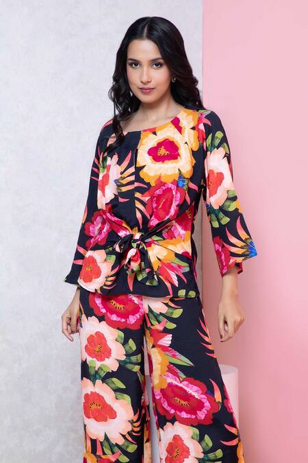 Rhe-Ana_Black Rayon Round Neck Vibrant Floral Print Knotted Top And Pant Set _at_Aza_Fashions