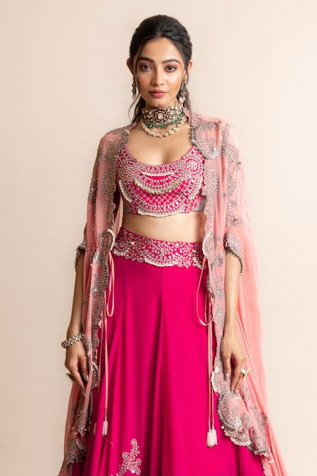 ShaadiWish - When it comes to contrasting your jewellery with your outfit,  it can go either way. But this bride surely nailed her gorgeous pink  lehengas with distinct pastel green jewellery pieces.