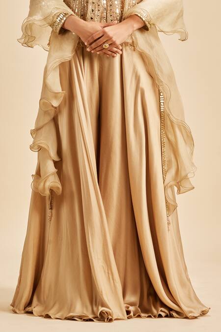 Nitika Gujral Gold Sharara Satin Embroidery Beads Sweetheart Neck Mirror Work Peplum Top Set Online at Aza Fashions Nitika Gujral_Gold Sharara Satin Embroidery Beads Sweetheart Neck Mirror Work Peplum Top Set _Online_at_Aza_Fashions