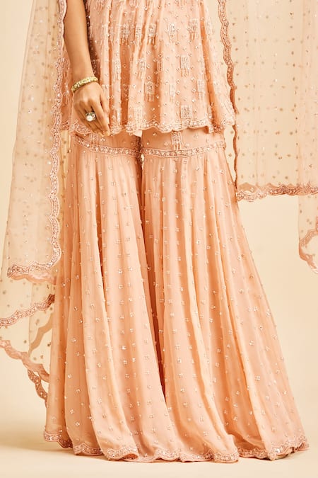 Nitika Gujral Peach Peplum Top And Sharara Georgette & Dupatta Net Embroidery Sequin Set Online at Aza Fashions Nitika Gujral_Peach Peplum Top And Sharara Georgette & Dupatta Net Embroidery Sequin Set _Online_at_Aza_Fashions
