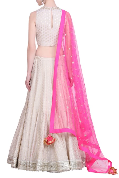 Shop Nikasha White Crepe Silk Foil Print, Lehenga With Sleeveless Blouse And Net Pink Dupatta at Aza Fashions Shop_Nikasha_White Crepe Silk Foil Print, Lehenga With Sleeveless Blouse And Net Pink Dupatta _at_Aza_Fashions