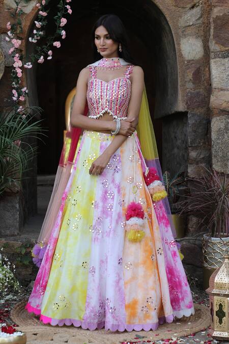 Shop_Nitisha Kashyap Official_Multi Color Net, Silk Tassels, Mirrors, Embroidery Tie And Dye Lehenga Set _Online_at_Aza_Fashions