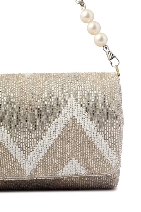 A Clutch Story_Silver Embroidery, Pearls Suede Metallic Zig Zag Flapover Clutch_at_Aza_Fashions