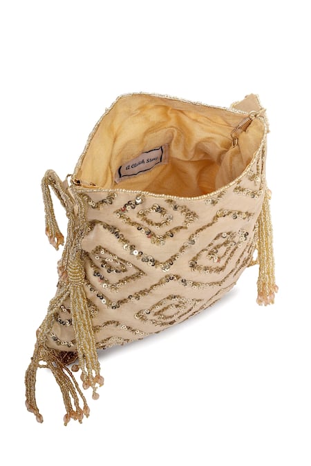 Shop_A Clutch Story_Beige Embellished Silk Rhombus Sparkle Potli_Online_at_Aza_Fashions