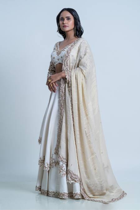 Nautanky_Ivory Silk, Organza Embroidery Asymmetric Raw Layered Lehenga Set _at_Aza_Fashions