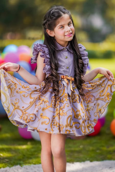 The Pony & Peony Co. Purple Cotton Embroidery, Bows Flutter Sleeve Top And Printed Skirt Online at Aza Fashions The Pony & Peony Co._Purple Cotton Embroidery, Bows Flutter Sleeve Top And Printed Skirt _Online_at_Aza_Fashions