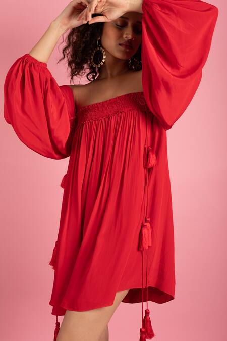 Style Junkiie Red Crepe Tassels Off-shoulder Off Smocked Dress at Aza Fashions Style Junkiie_Red Crepe Tassels Off-shoulder Off Smocked Dress _at_Aza_Fashions
