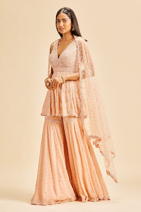 Shop Nitika Gujral Peach Peplum Top And Sharara Georgette & Dupatta Net Embroidery Sequin Set Online at Aza Fashions Shop_Nitika Gujral_Peach Peplum Top And Sharara Georgette & Dupatta Net Embroidery Sequin Set _Online_at_Aza_Fashions