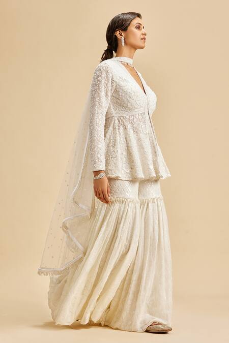 Buy Nitika Gujral Ivory Peplum Top And Gharara Georgette & Dupatta Net Embroidery Floral Set Online at Aza Fashions Buy_Nitika Gujral_Ivory Peplum Top And Gharara Georgette & Dupatta Net Embroidery Floral Set _Online_at_Aza_Fashions