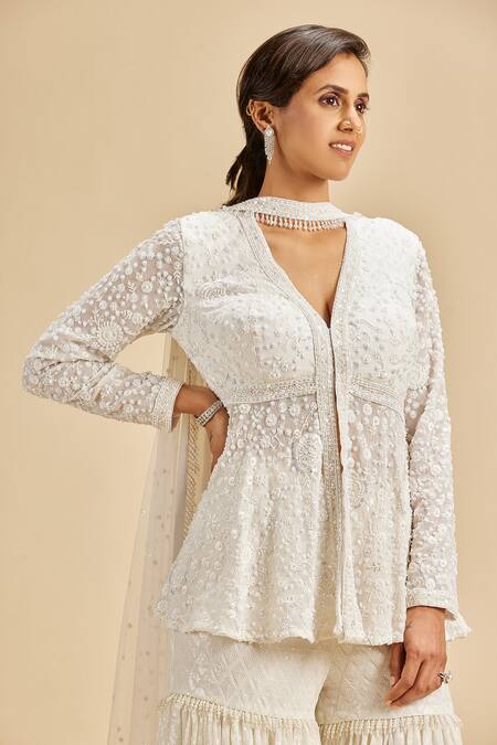 Shop Nitika Gujral Ivory Peplum Top And Gharara Georgette & Dupatta Net Embroidery Floral Set Online at Aza Fashions Shop_Nitika Gujral_Ivory Peplum Top And Gharara Georgette & Dupatta Net Embroidery Floral Set _Online_at_Aza_Fashions