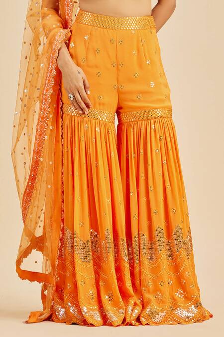 Shop Nitika Gujral Orange Blouse And Gharara Georgette Embroidery Sequin Halter Neck Set Online at Aza Fashions Shop_Nitika Gujral_Orange Blouse And Gharara Georgette Embroidery Sequin Halter Neck Set _Online_at_Aza_Fashions
