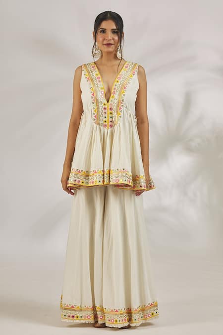 Gopi Vaid Ivory Cotton Sequins, Mirrors Plunge Hana Embroidered Peplum Kurta With Sharara at Aza Fashions Gopi Vaid_Ivory Cotton Sequins, Mirrors Plunge Hana Embroidered Peplum Kurta With Sharara _at_Aza_Fashions