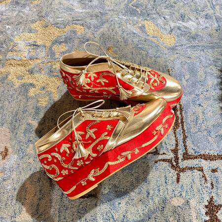 Tiesta_Red Begum Embellished Sneaker Wedges _at_Aza_Fashions