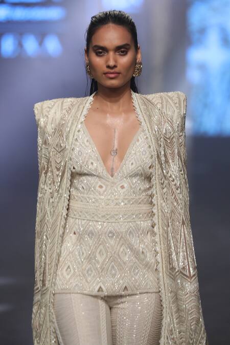 Ritika Mirchandani Ivory Stretch Satin Embroidery Bead Cape Esma Bell Bottom Pant Set Online at Aza Fashions Ritika Mirchandani_Ivory Stretch Satin Embroidery Bead Cape Esma Bell Bottom Pant Set _Online_at_Aza_Fashions